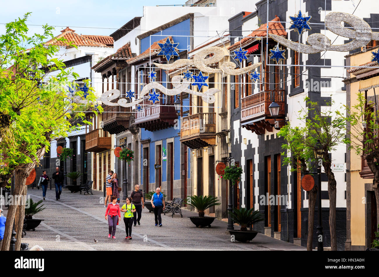 street with tourists and wooden balconies,Teror, Gran Canaria Stock Photo
