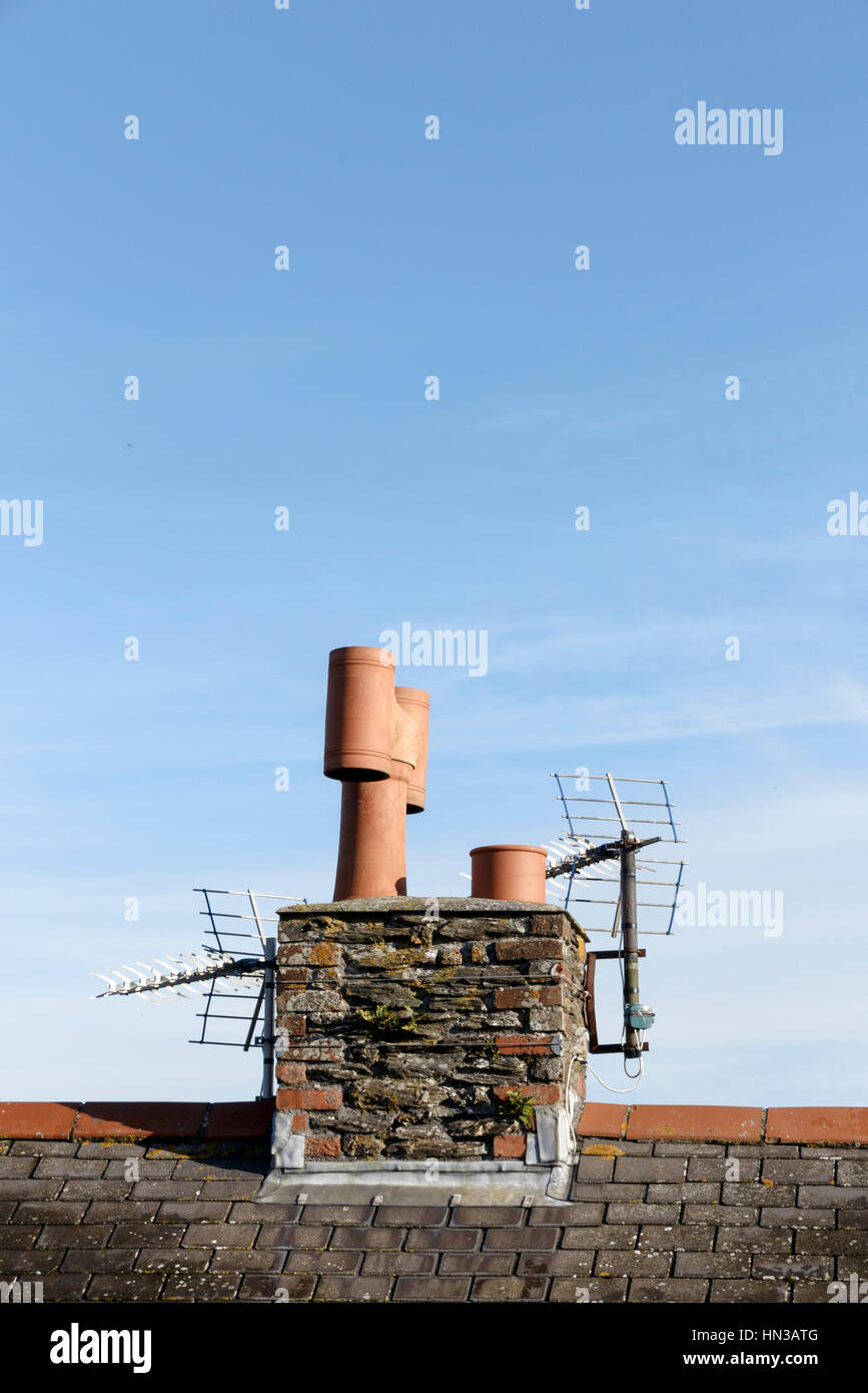 Chimney with pots and television aerial Stock Photo