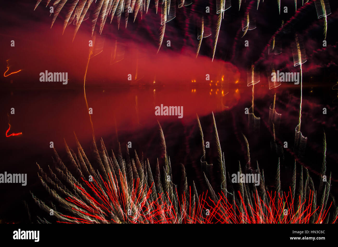 Fireworks display bursts at night Stock Photo