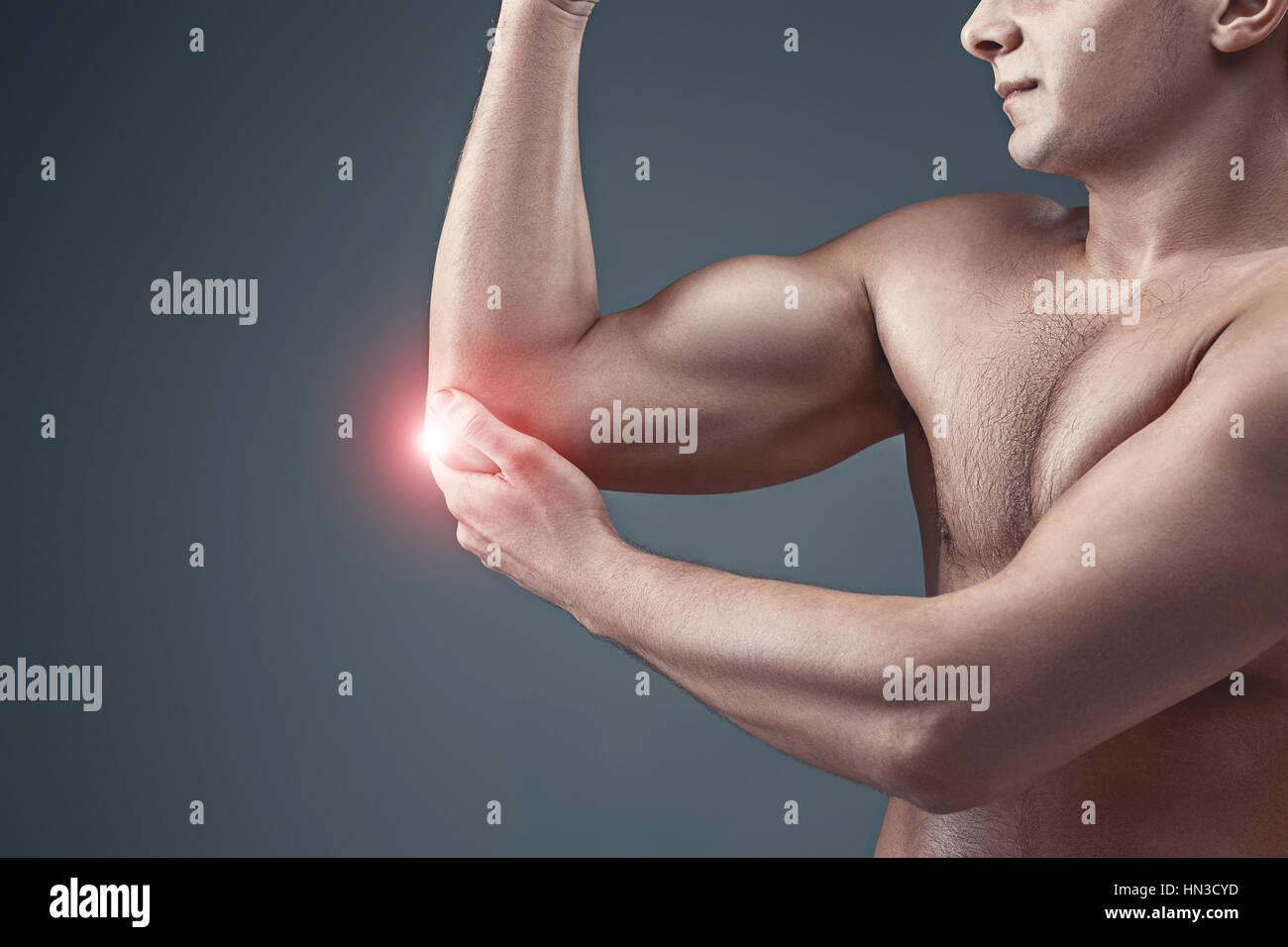 https://c8.alamy.com/comp/HN3CYD/man-with-pain-in-elbow-pain-relief-concept-HN3CYD.jpg