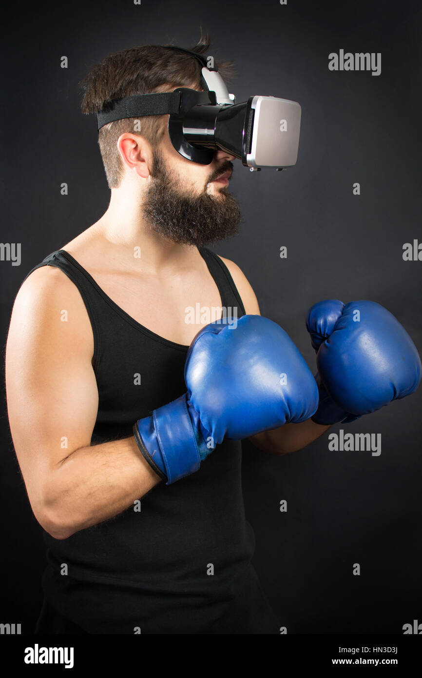 Bearded man with VR glasses standing in boxing guard Stock Photo Alamy
