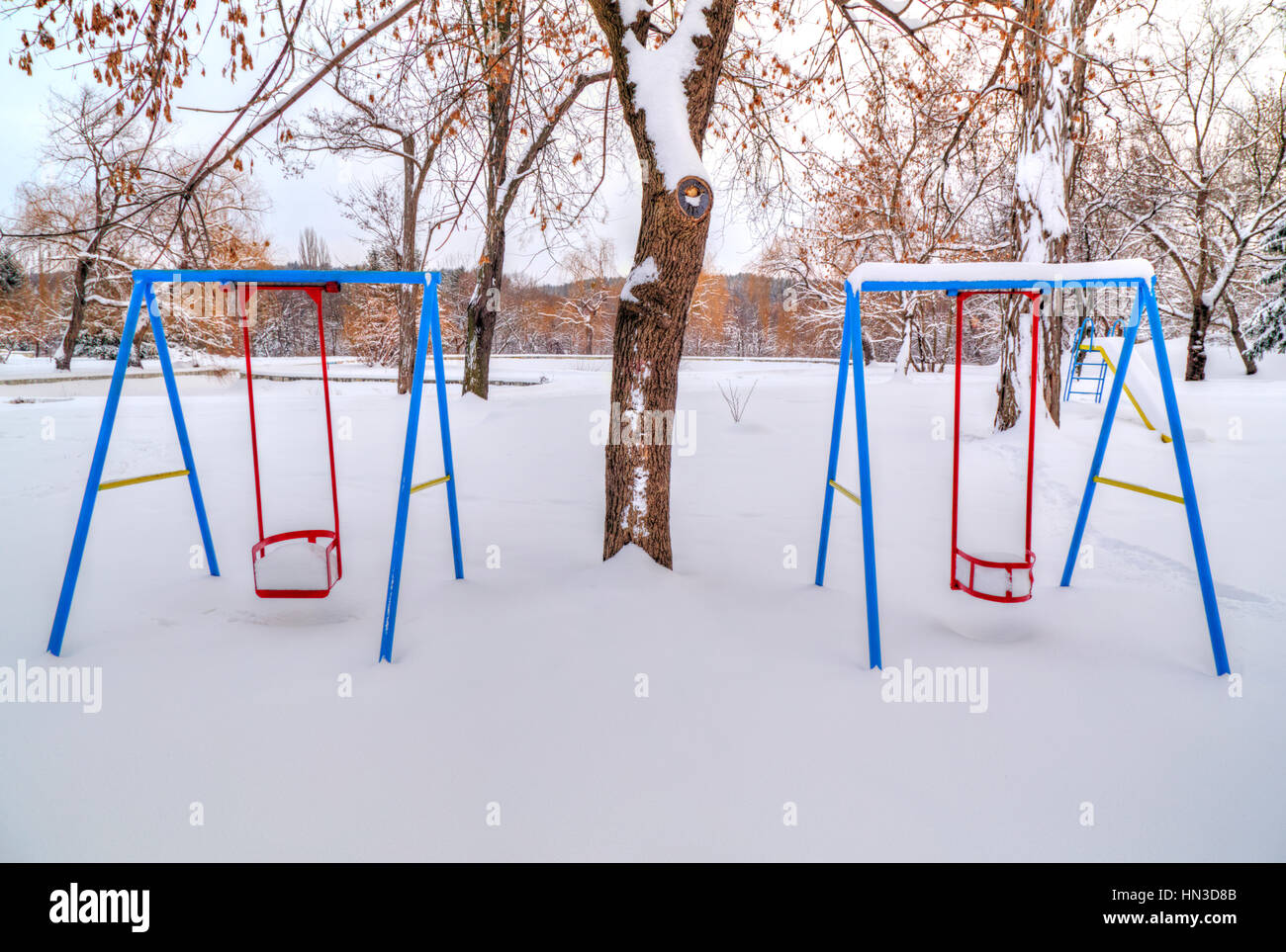 Children's playground covered with snow in winter Stock Photo - Alamy