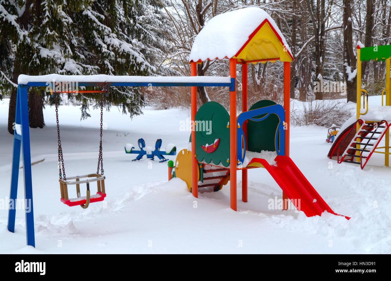 Children's playground covered with snow in winter Stock Photo - Alamy