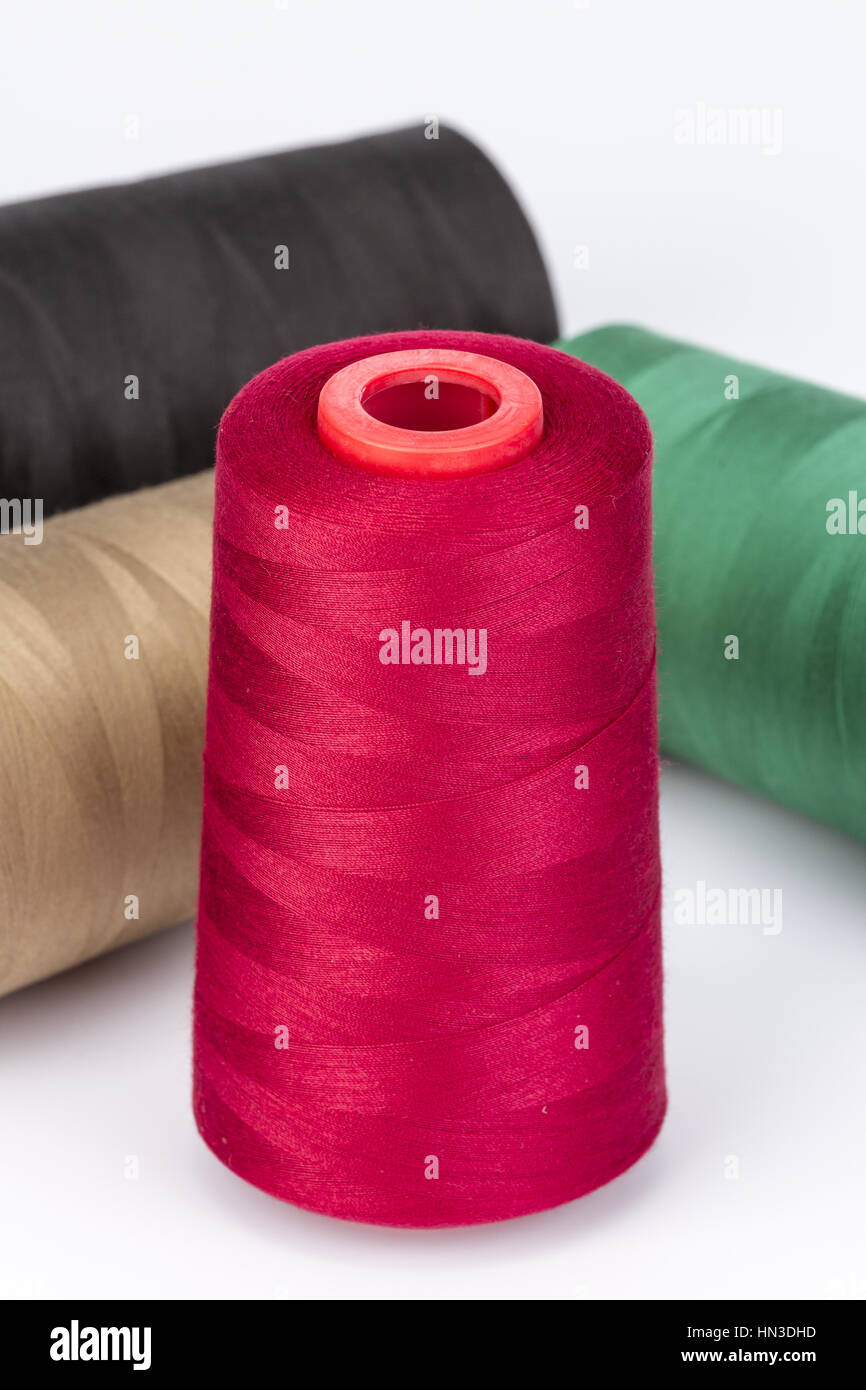 Red Sewing Thread and group on white background Stock Photo - Alamy