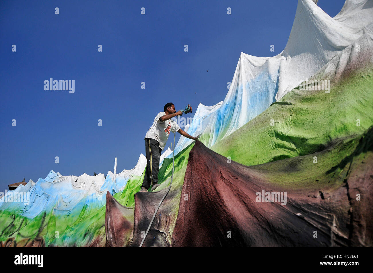 Kathmandu, Nepal. 07th Feb, 2017. ARBINDRA YADAV, 45yrs old, a migrant labourer from India spray painting a temporary temple of Kedarnath and Badrinath at the premises of Pashupatinath Temple, Kathmandu, Nepal on Kathmandu, Nepal. 07th Feb, 2017. ARBINDRA YADAV, 45yrs old, a migrant labourer from India spray painting a temporary temple of Kedarnath and Badrinath at the premises of Pashupatinath Temple, Kathmandu, Nepal on