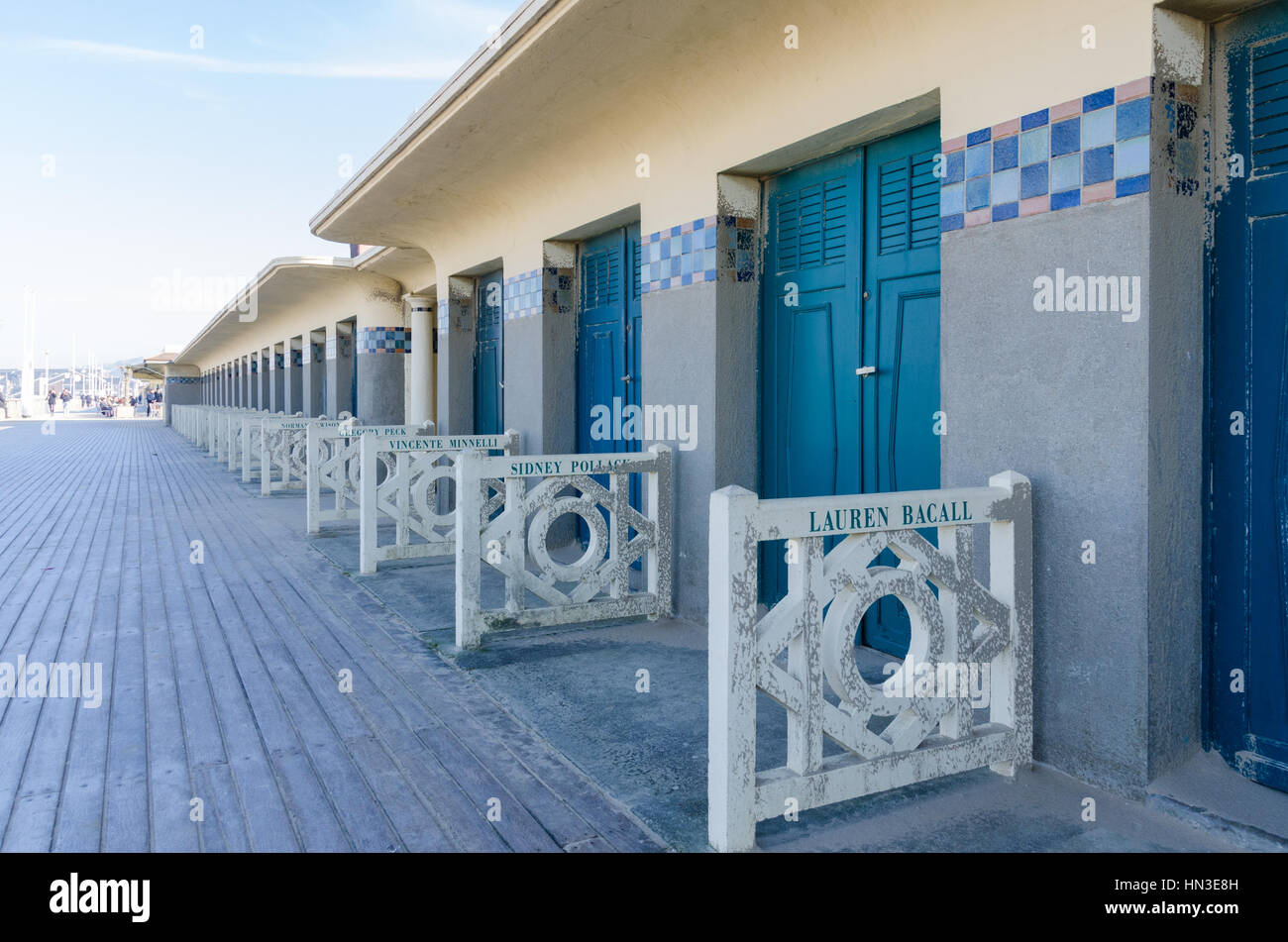 Bathing cabins along Les Planches boardwalk by the beach in the chic french seaside resort of Deauville Stock Photo
