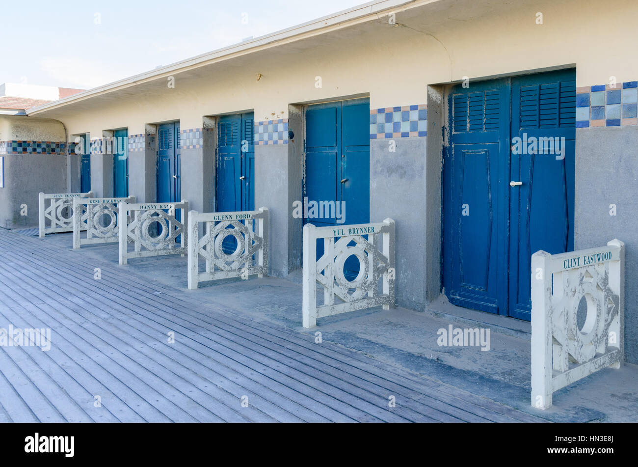 Bathing cabins along Les Planches boardwalk by the beach in the chic french seaside resort of Deauville Stock Photo