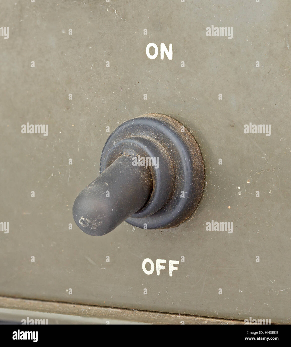 closed up old black toggle switch on green surface - off Stock Photo ...