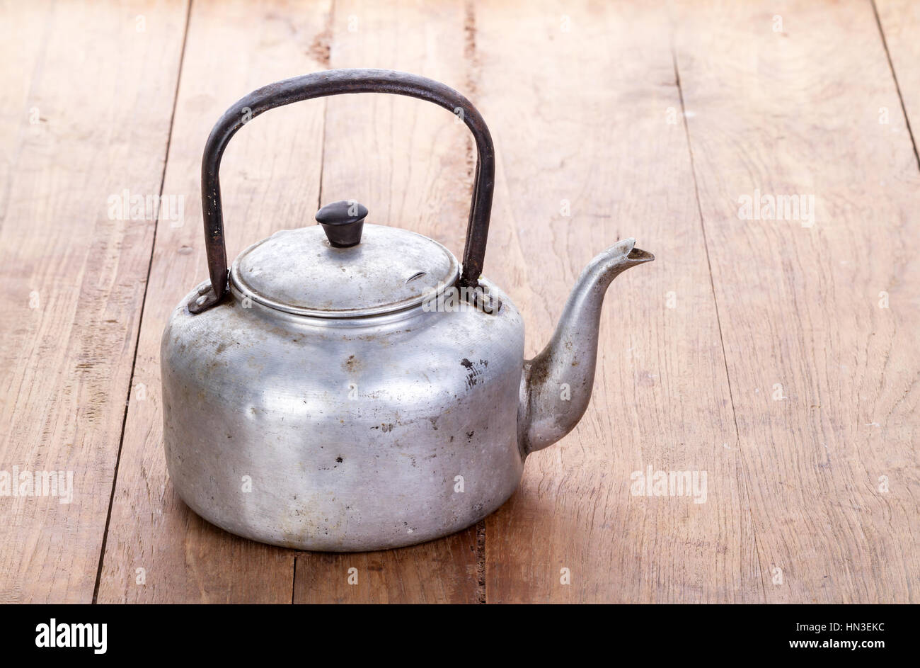 Vintage large aluminum tea pot kettle stove top isolated Stock Photo by  puhimec