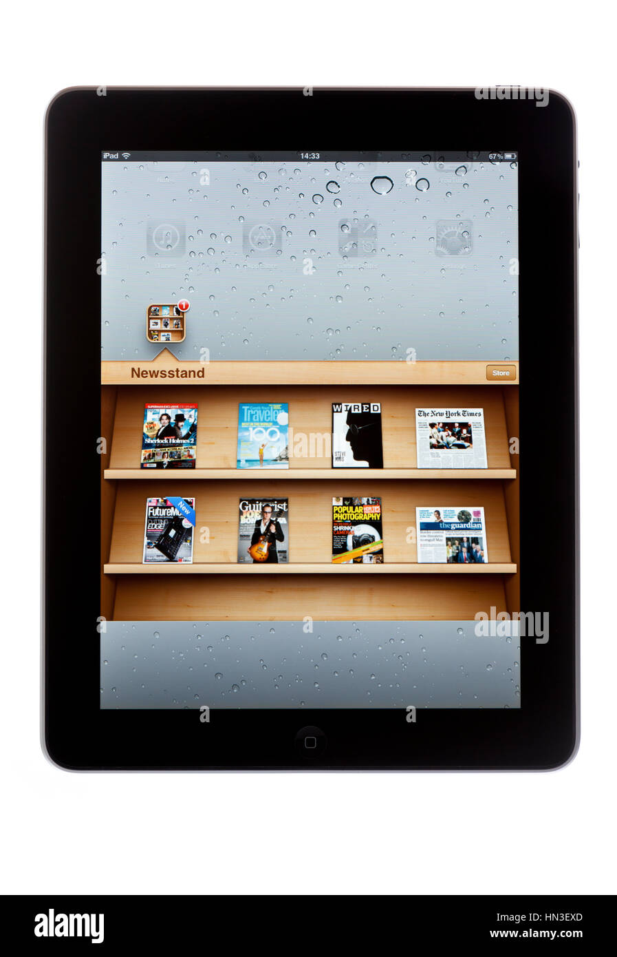 BATH, UK - NOVEMBER 8, 2011: An Apple iPad displaying the Newsstand application against a white background. Newsstand allows users to download iPad ed Stock Photo