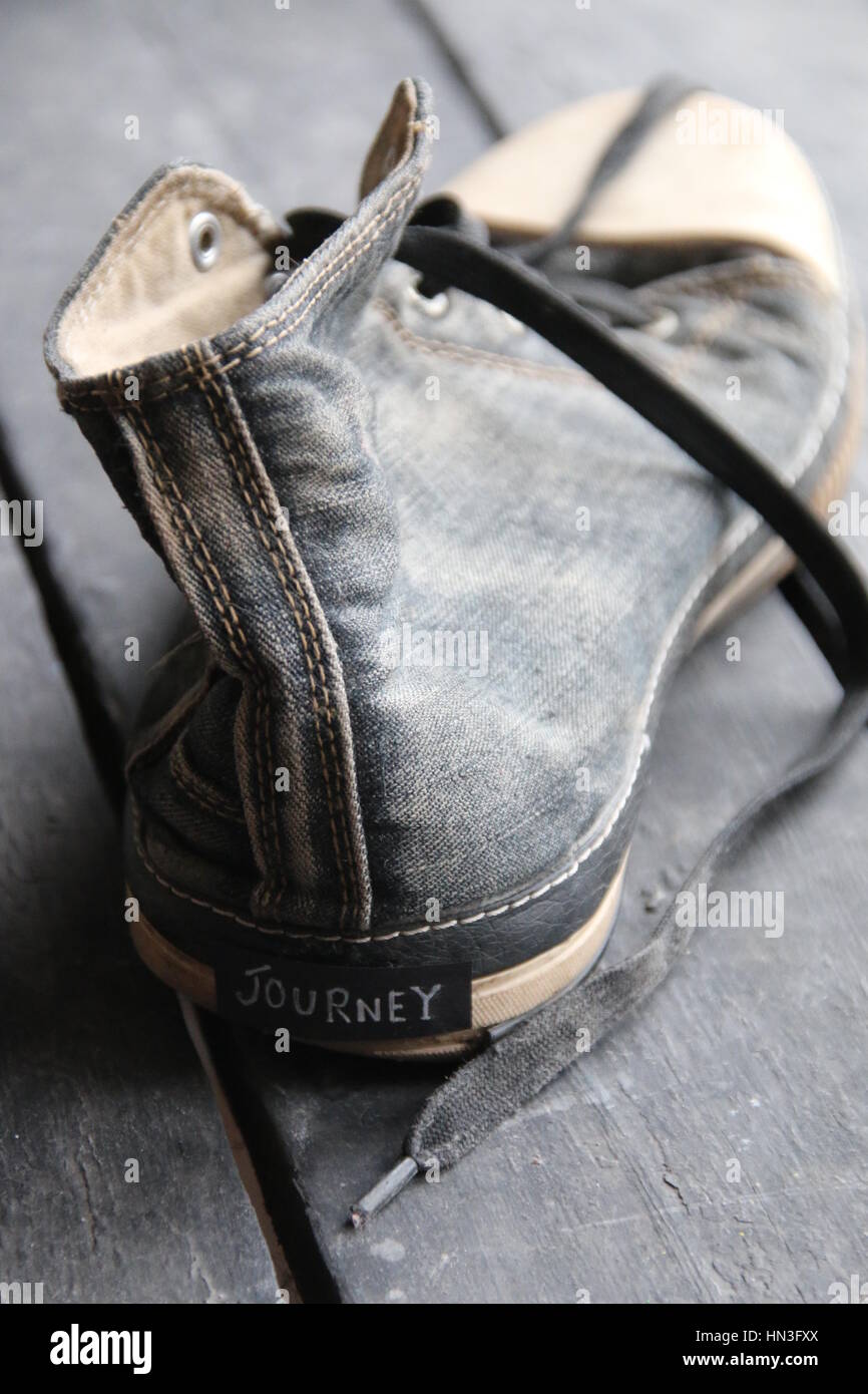 Journey label and retro sneaker shoes Stock Photo