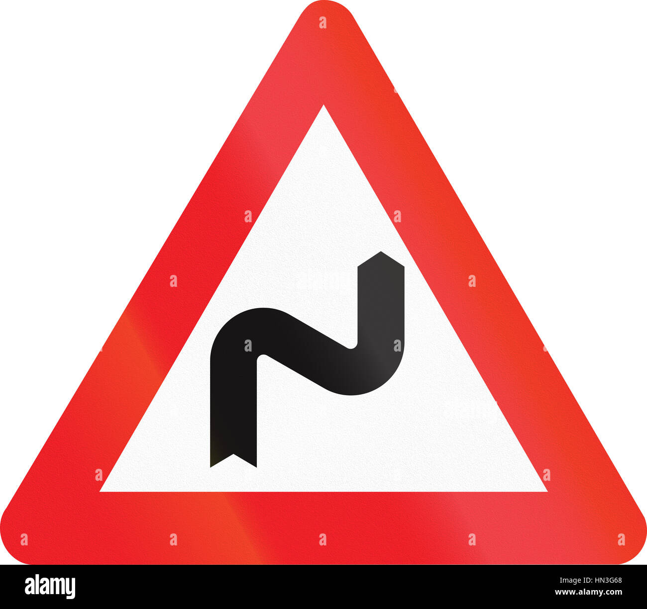 Belgian warning road sign - Double bend, first to right. Stock Photo