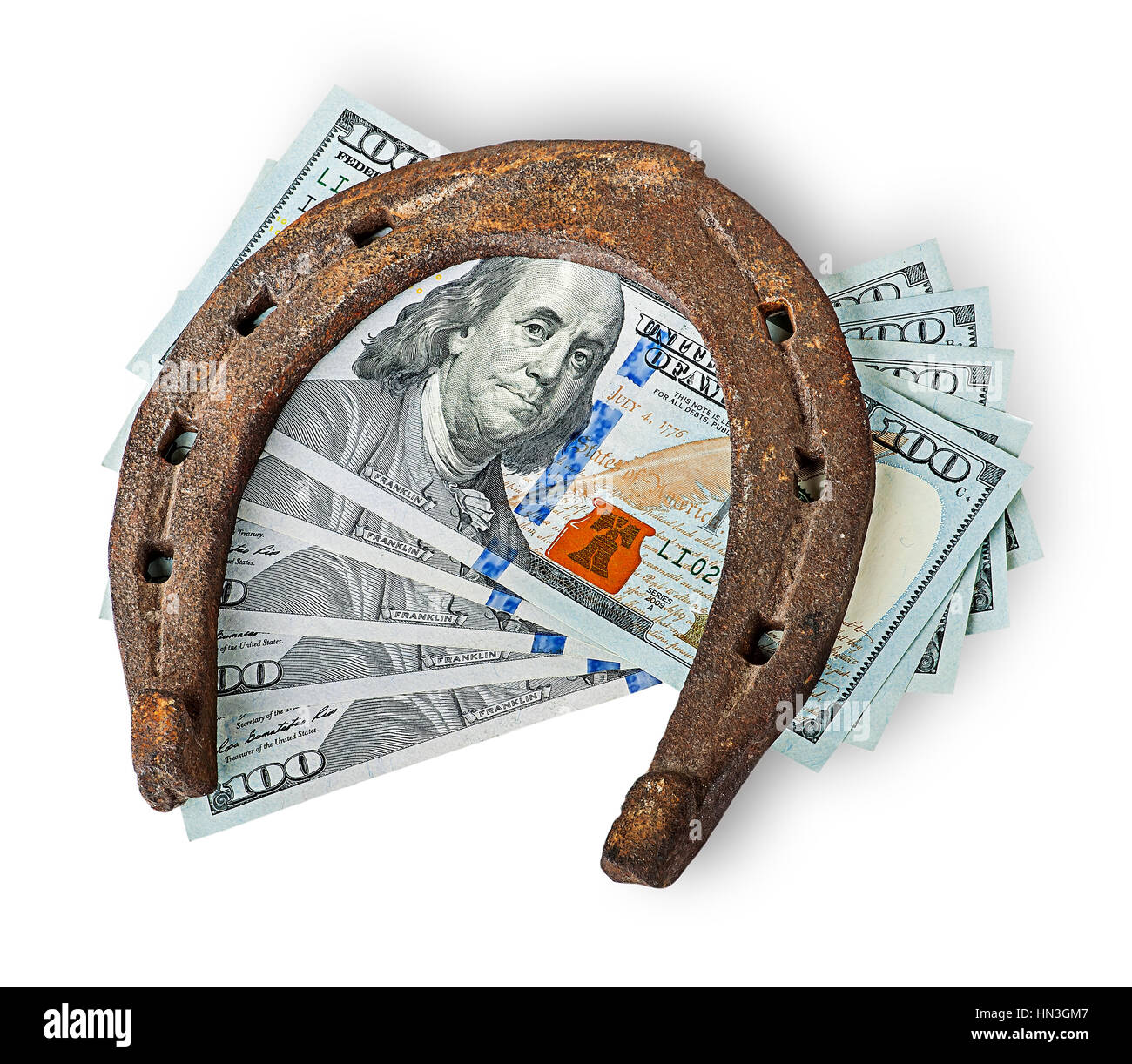 Old rusty horseshoe and money isolated on white background Stock Photo