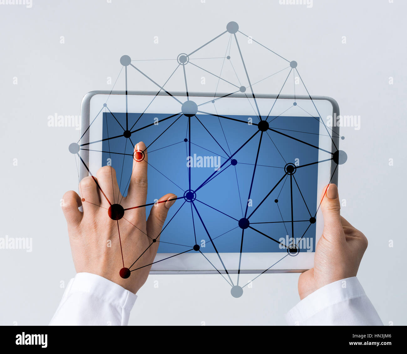 Tablet pc device with connection lines on screen in hands of doctor ...