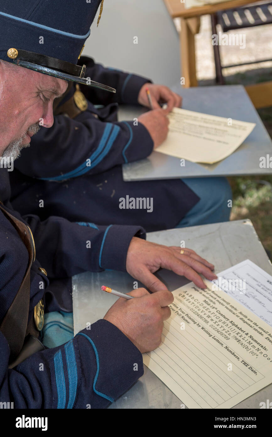 Fort Stanton, New Mexico - Civil War-era soldiers learn to read and write at 'Fort Stanton Live!,' an annual living history program. Fort Stanton was  Stock Photo