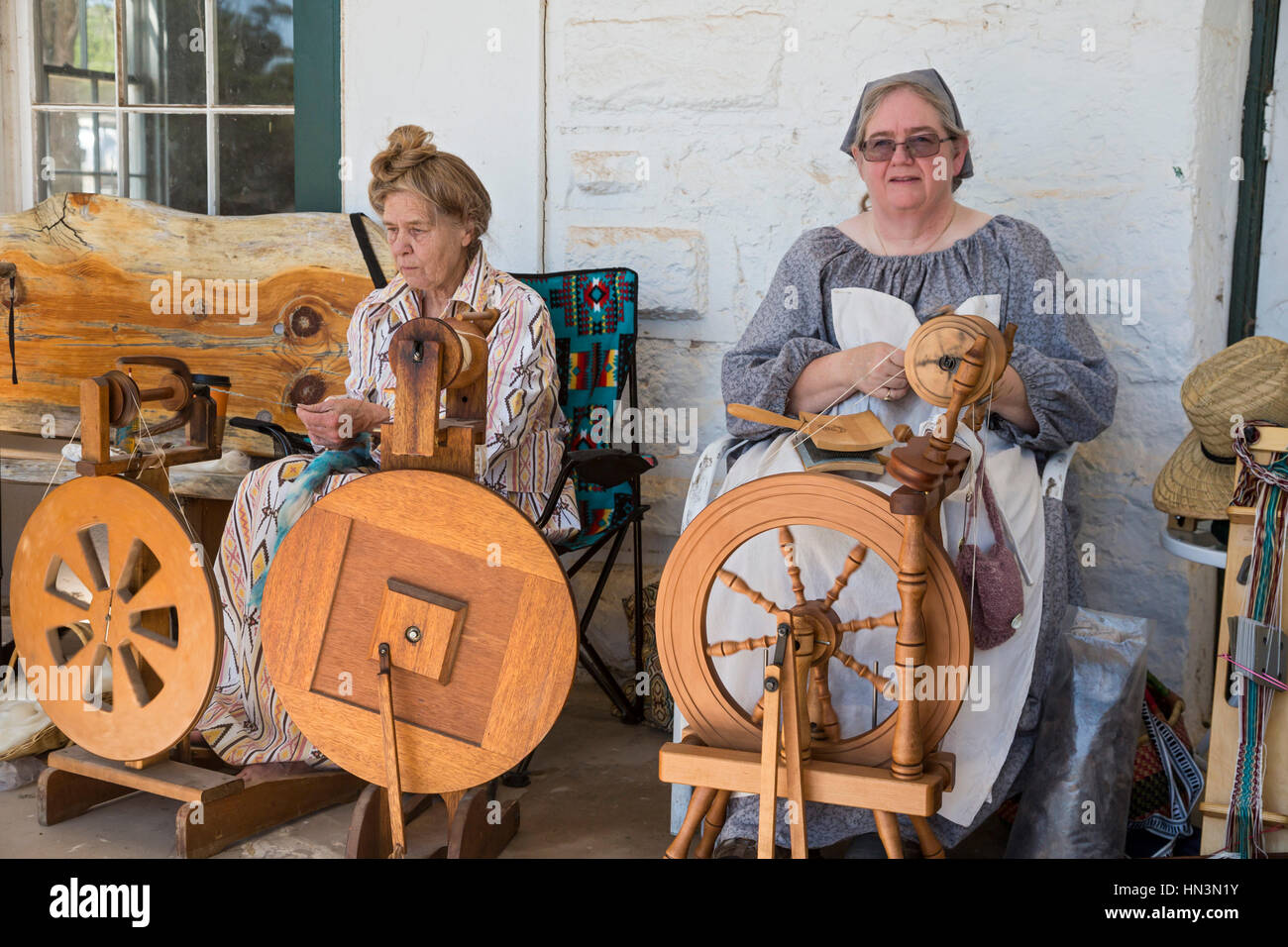 Fort Stanton, New Mexico - Women demonstrate spinning wool during 'Fort Stanton Live!,' an annual living history program. Fort Stanton was built in 18 Stock Photo