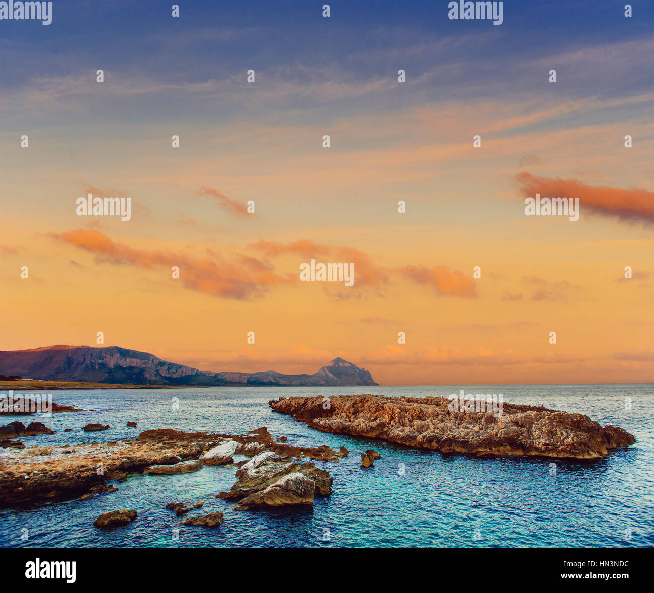 Sea coast at sunset Stock Photo - Alamy