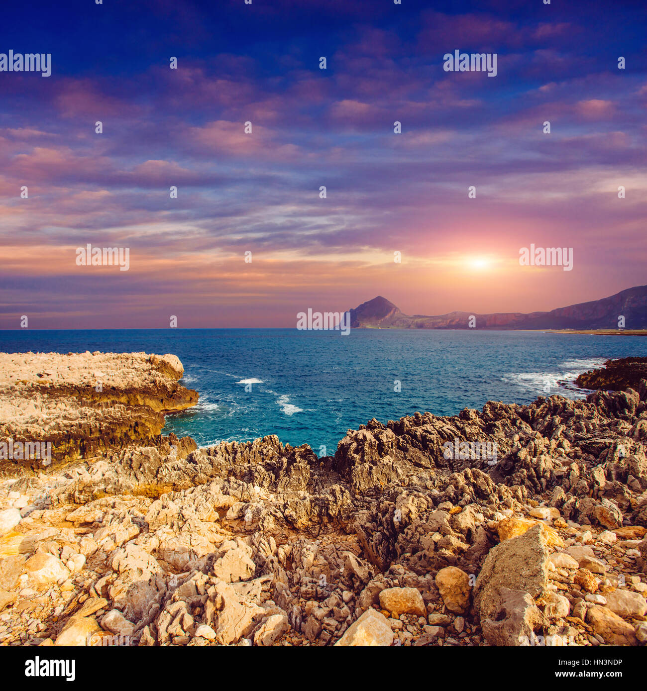 Sea coast at sunset Stock Photo - Alamy