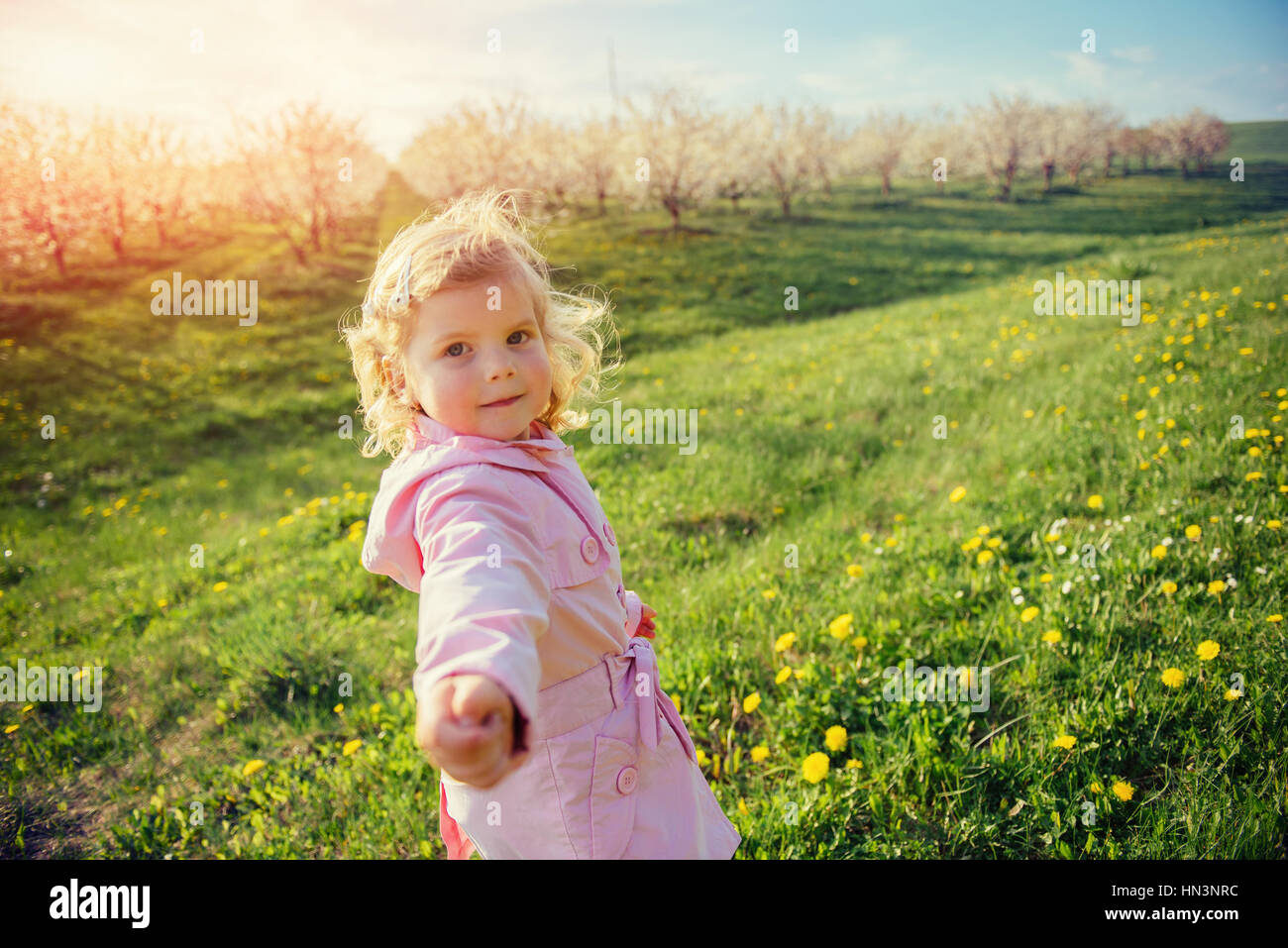 child playing on  sunny spring day. Toning effect. Stock Photo