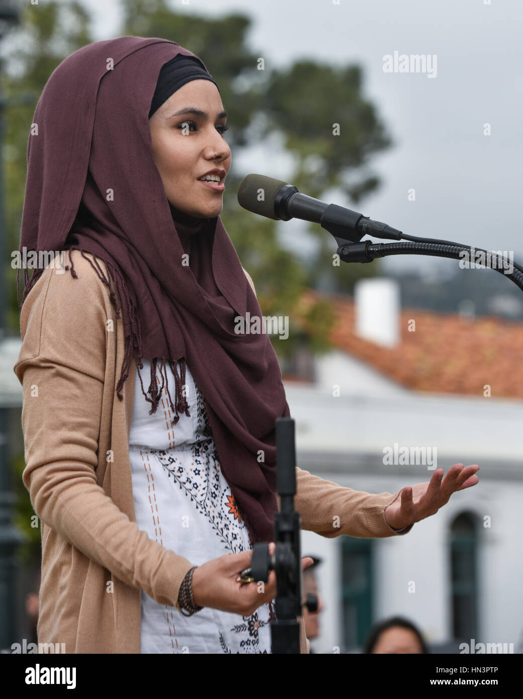 Organizer, Aida Jaan, of the Blessed Tree Foundation, speaking at an Anti Muslim Travel Ban rally in Santa Barbara, CA Stock Photo