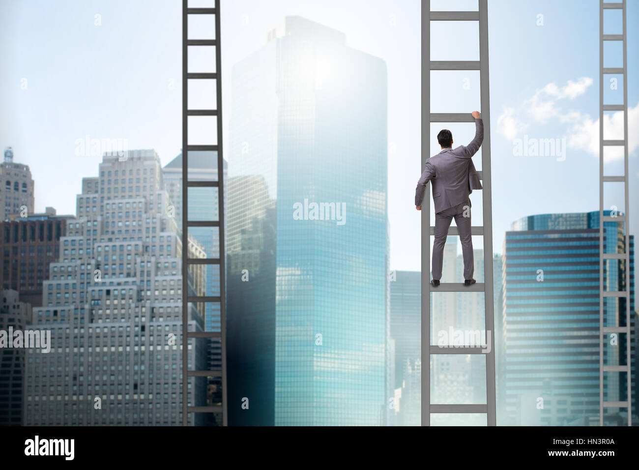 Young businessman climbing career ladder Stock Photo - Alamy