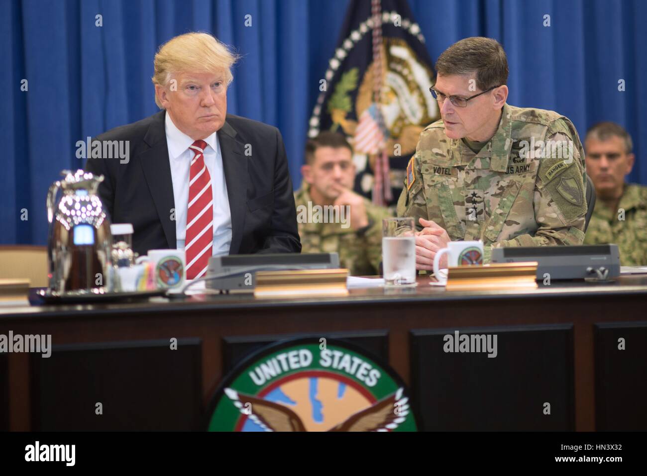 U.S President Donald Trump listens as Gen. Joseph Votel, commander of U.S. Central Command, provides a briefing of current military operations during a visit to U.S. Central Command at MacDill Air Force Base February 6, 2017 in Tampa, Florida. Credit: Planetpix/Alamy Live News Stock Photo