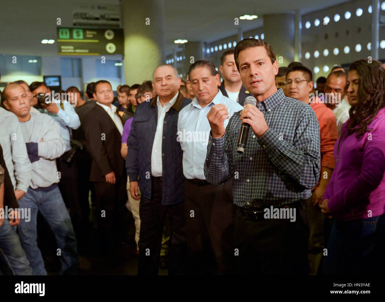 Mexico City, Mexico. 7th February, 2017. Mexican President Enrique Pena Nieto welcomes home 135 Mexican migrants deported from the United States on arrival at Mexico City International Airport February 7, 2017 in Mexico City, Mexico. The group was the first deportees since Donald Trump became President.     (Government of Mexico via Planetpix) Stock Photo