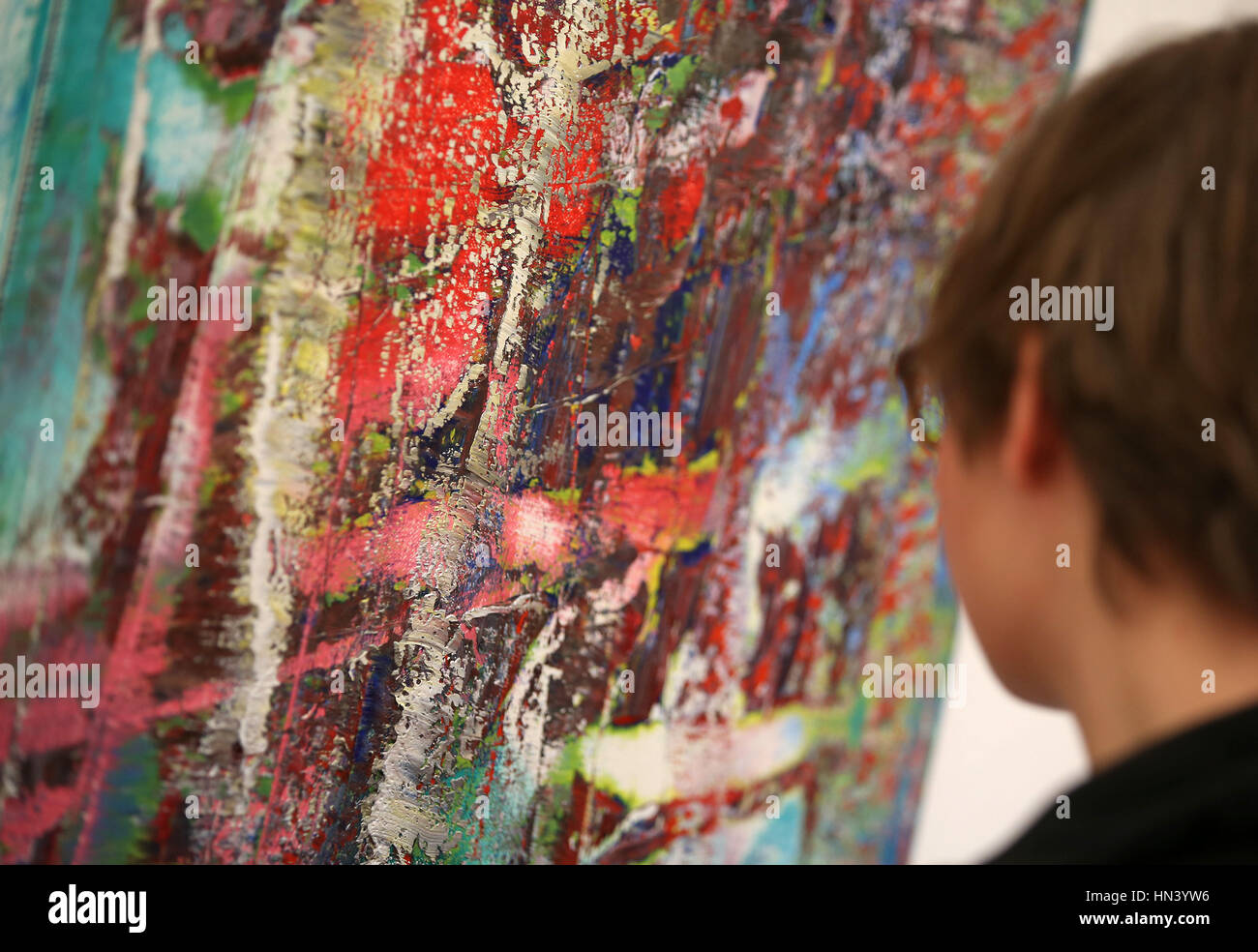 Cologne, Germany. 7th Feb, 2017. A woman gazes at the painting 'Abstraktes Bild' from Gerhard Richter in Cologne, Germany, 7 February 2017. The exhibition 'New Pictures' for Richter's 85th birthday will be opened on the 9 February 2017 at the Museum Ludwig. Photo: Oliver Berg/dpa/Alamy Live News Stock Photo