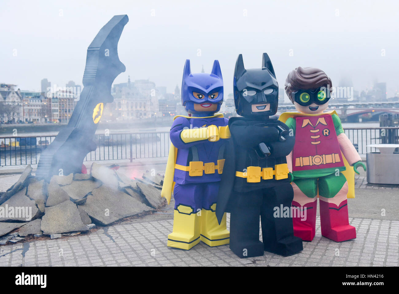 London, UK. 8th Feb, 2017. LEGO Batman, Batgirl and Robin costumed  characters pose with a giant LEGO Batarang, which has crash landed at  Observation Point on the South Bank. Created to celebrate