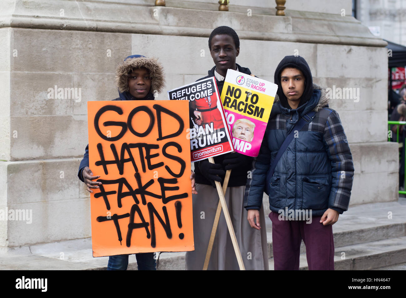 London, UK, 4th Feb, 2017, 'God Hates Fake Tan' at Downing St at the Stop Trump Demo. Credit: Aimvphotography Stock Photo