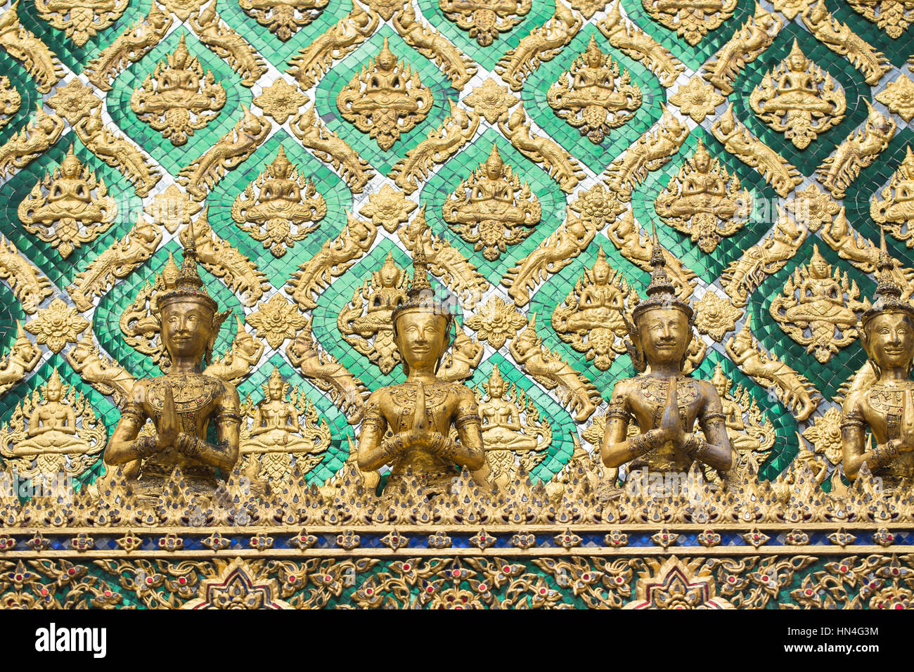 Thai antique art decoration buddhist temple wall, golden angle wallpaper  for background background design Stock Photo - Alamy