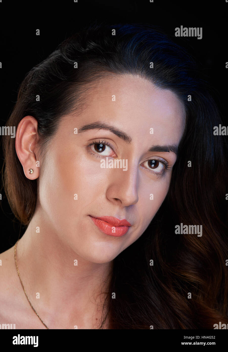 headshot of skinny girl isolated on black background Stock Photo