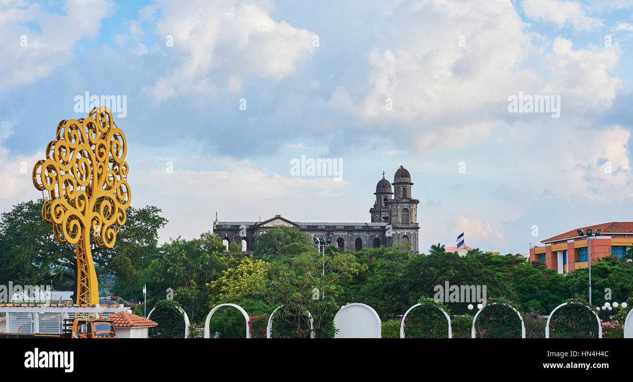 cityscape of managua city with old cathedral and metal yellow tree Stock Photo