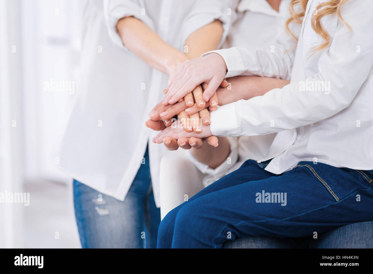 Close up of family members holding hands together Stock Photo - Alamy
