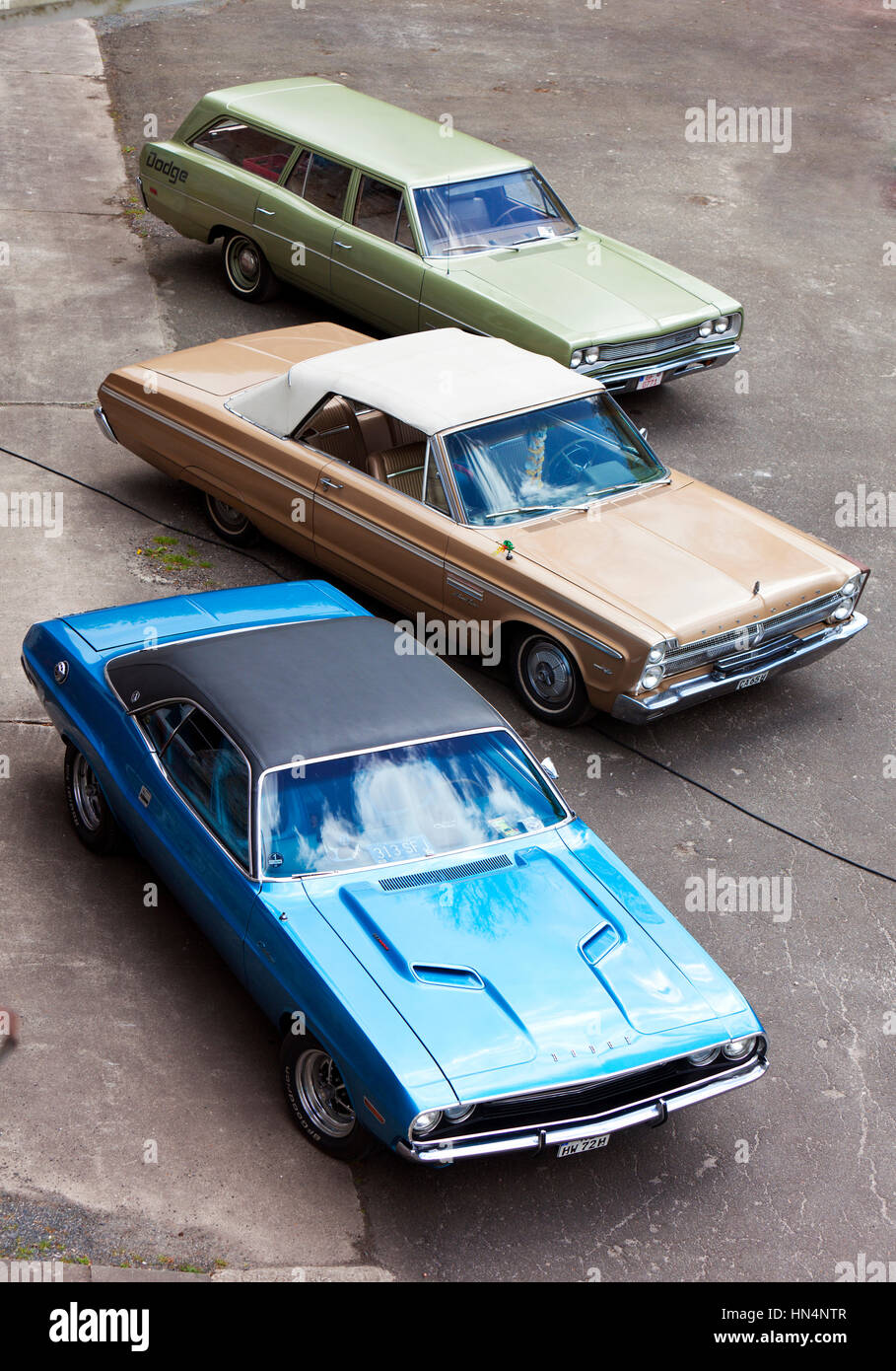 Stade, Germany - May 2, 2015: 1969 Dodge Coronet Station Wagon, 1965 Plymouth Sport Fury Convertible and 1972 Dodge Charger at MOPAR Spring Fling, ann Stock Photo