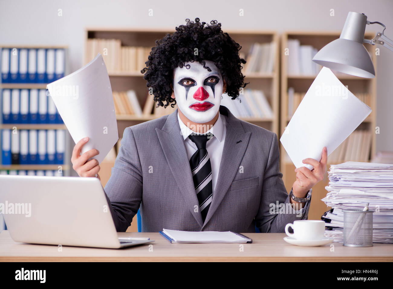 Work Cloan Clown businessman working in the office Stock Photo - Alamy