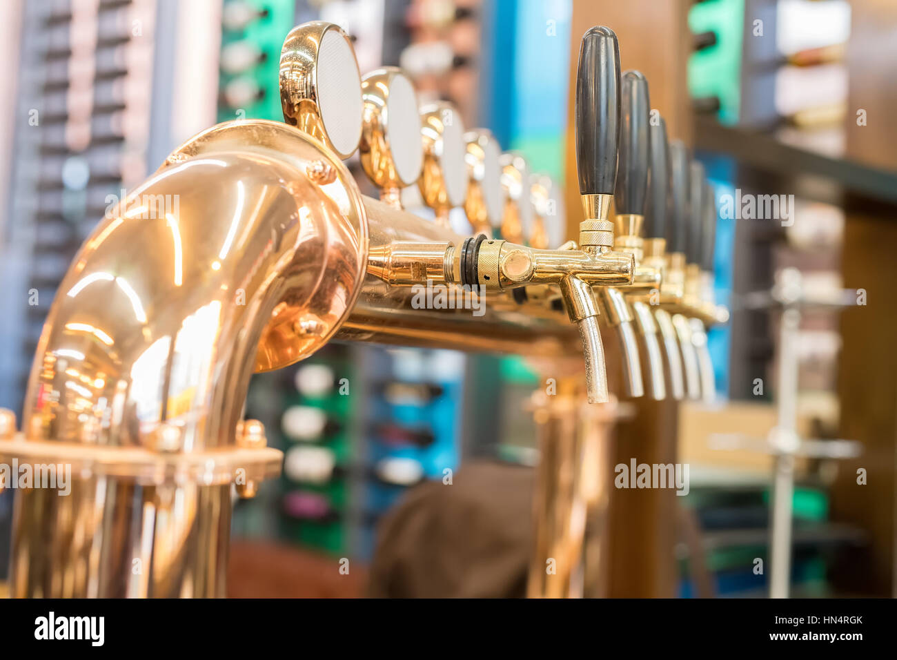 Draught beer taps in a bar. Stock Photo