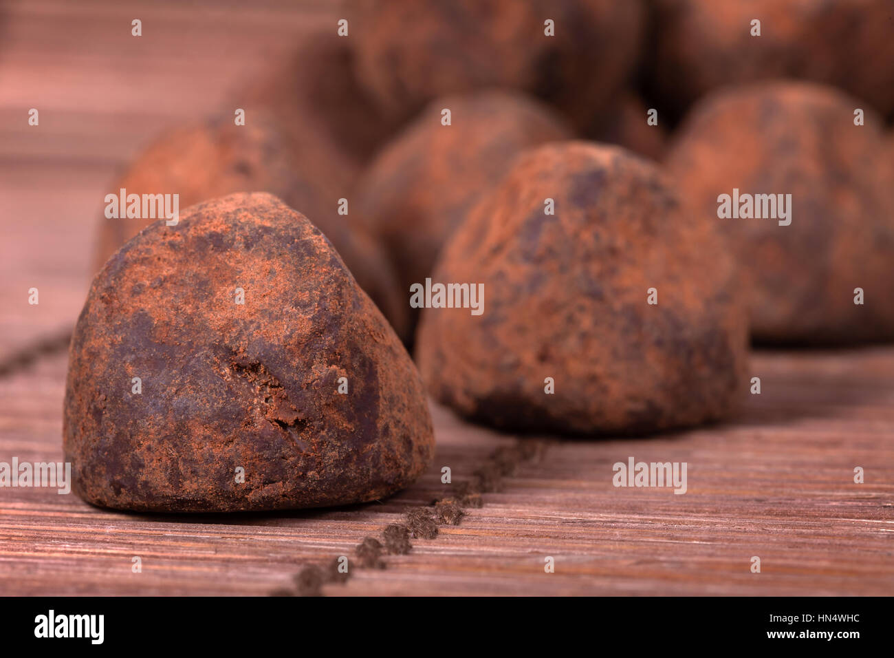 Black chocolate truffles covered with cinnamon powder Stock Photo