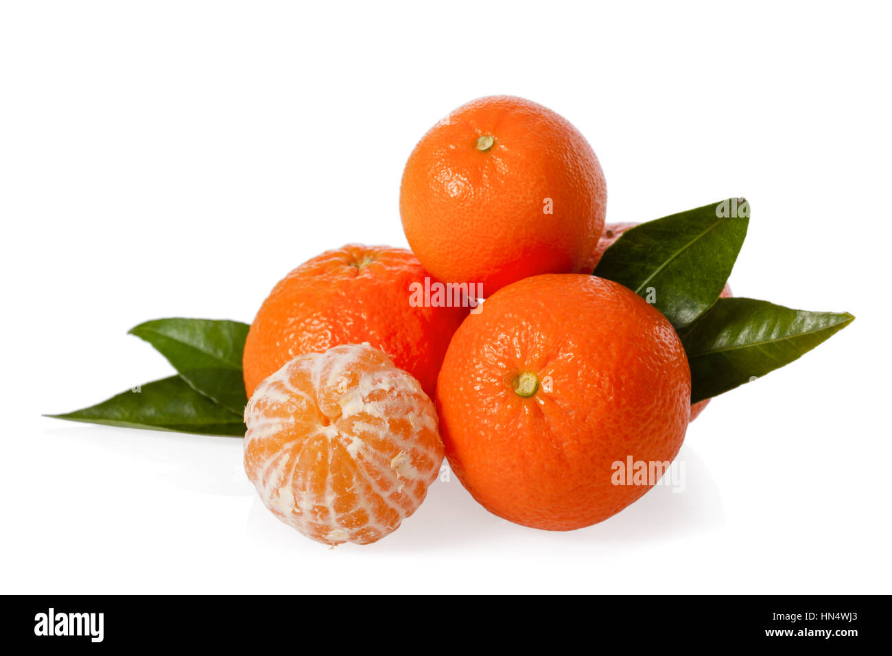 Clementines with a peeled clementine isolated on white background Stock