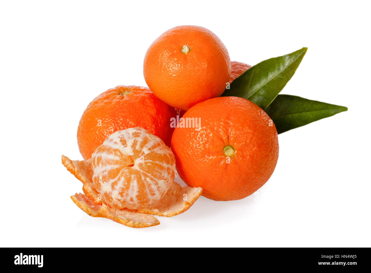 Clementines with a peeled clementine isolated on white background Stock