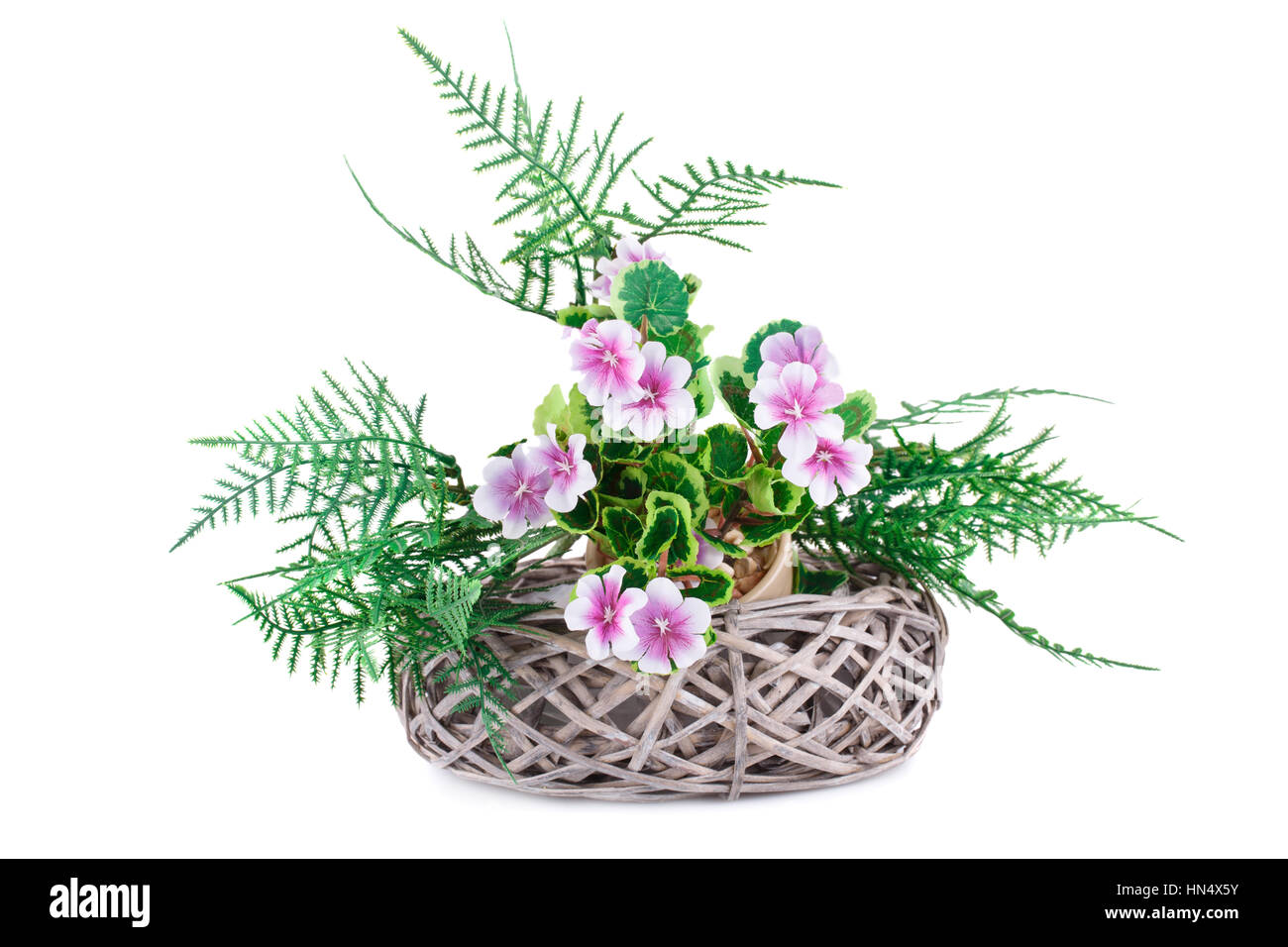 Pink fabric flowers in wicker basket isolated on white background Stock ...