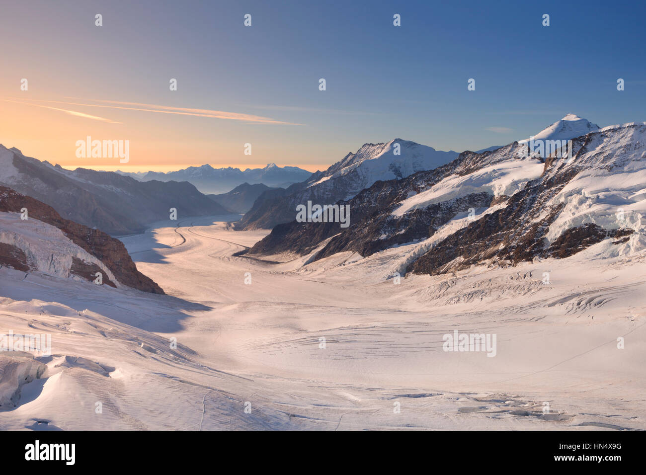 Sunrise over the Aletsch Glacier from Jungfraujoch in Switzerland on a clear morning. Stock Photo