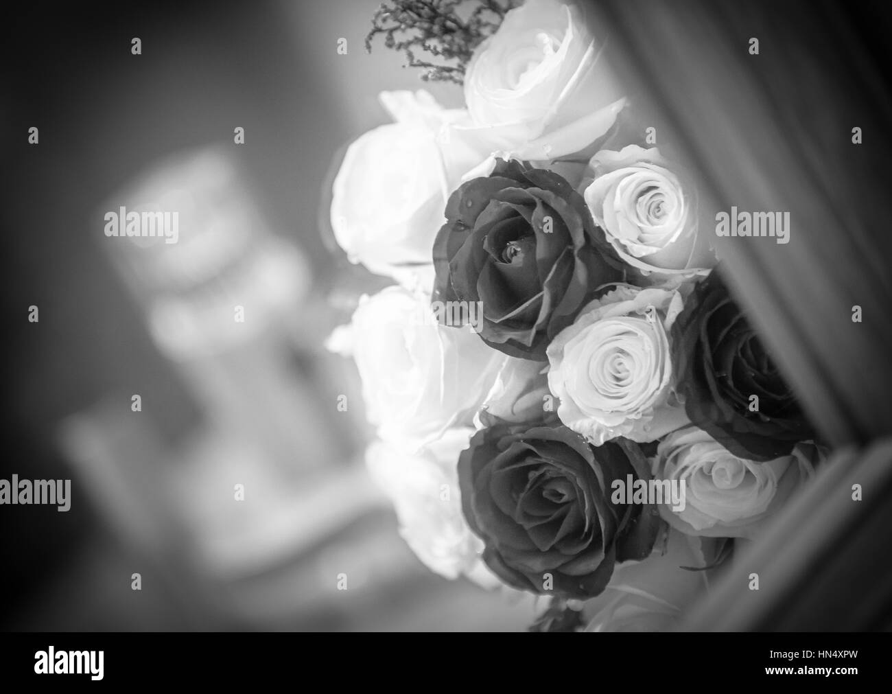 Red roses wedding bouquet in glass holder on table Stock Photo Alamy