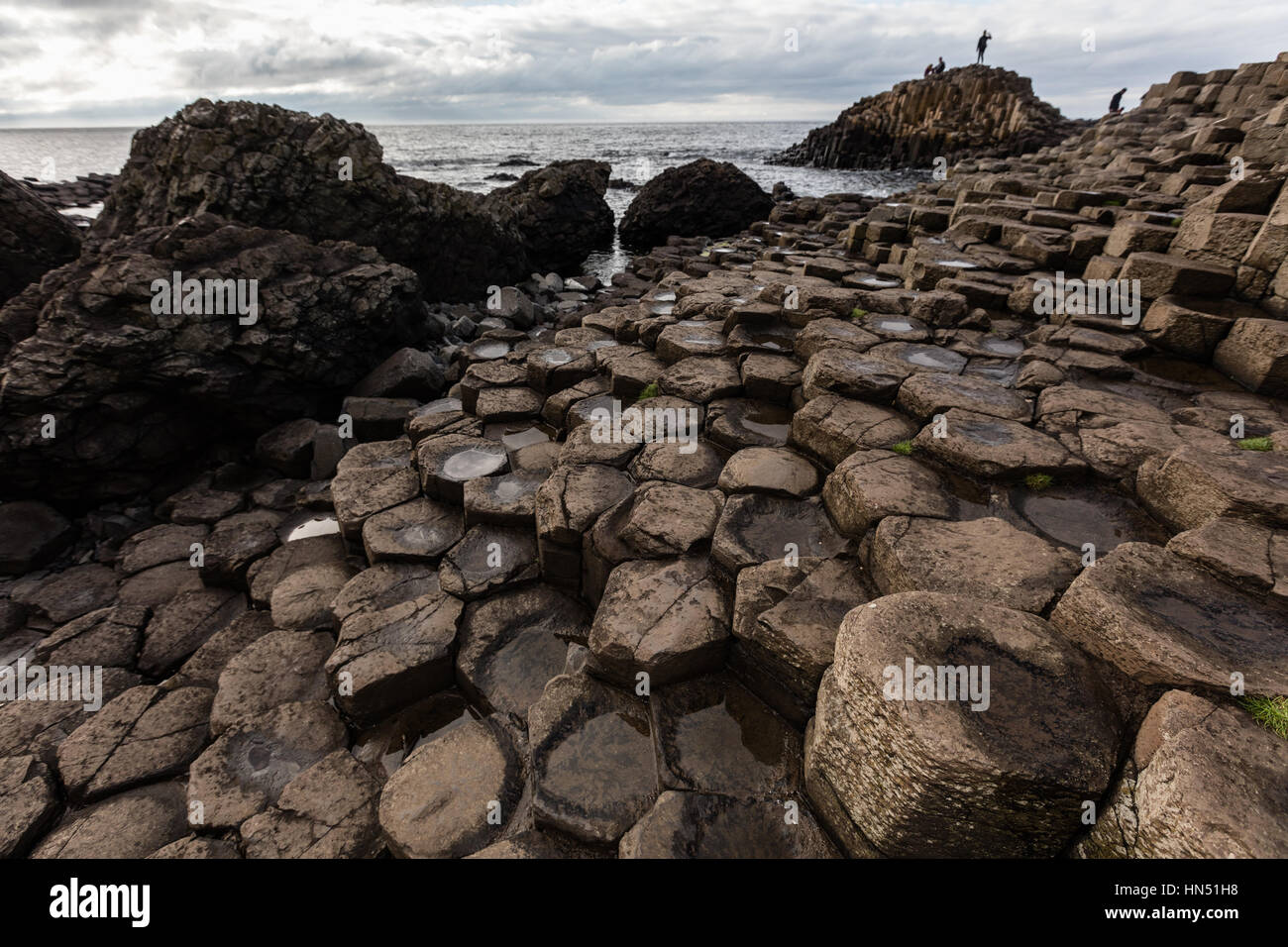 The Giant's Causeway is an area of about 40,000 interlocking basalt columns, the result of an ancient volcanic eruption. Stock Photo
