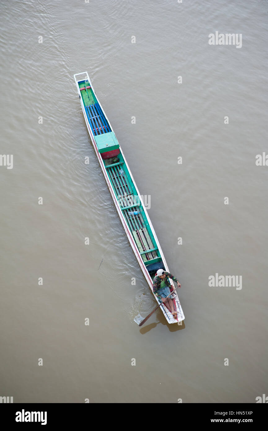 Long boat on Nam ou river, man rowing Stock Photo