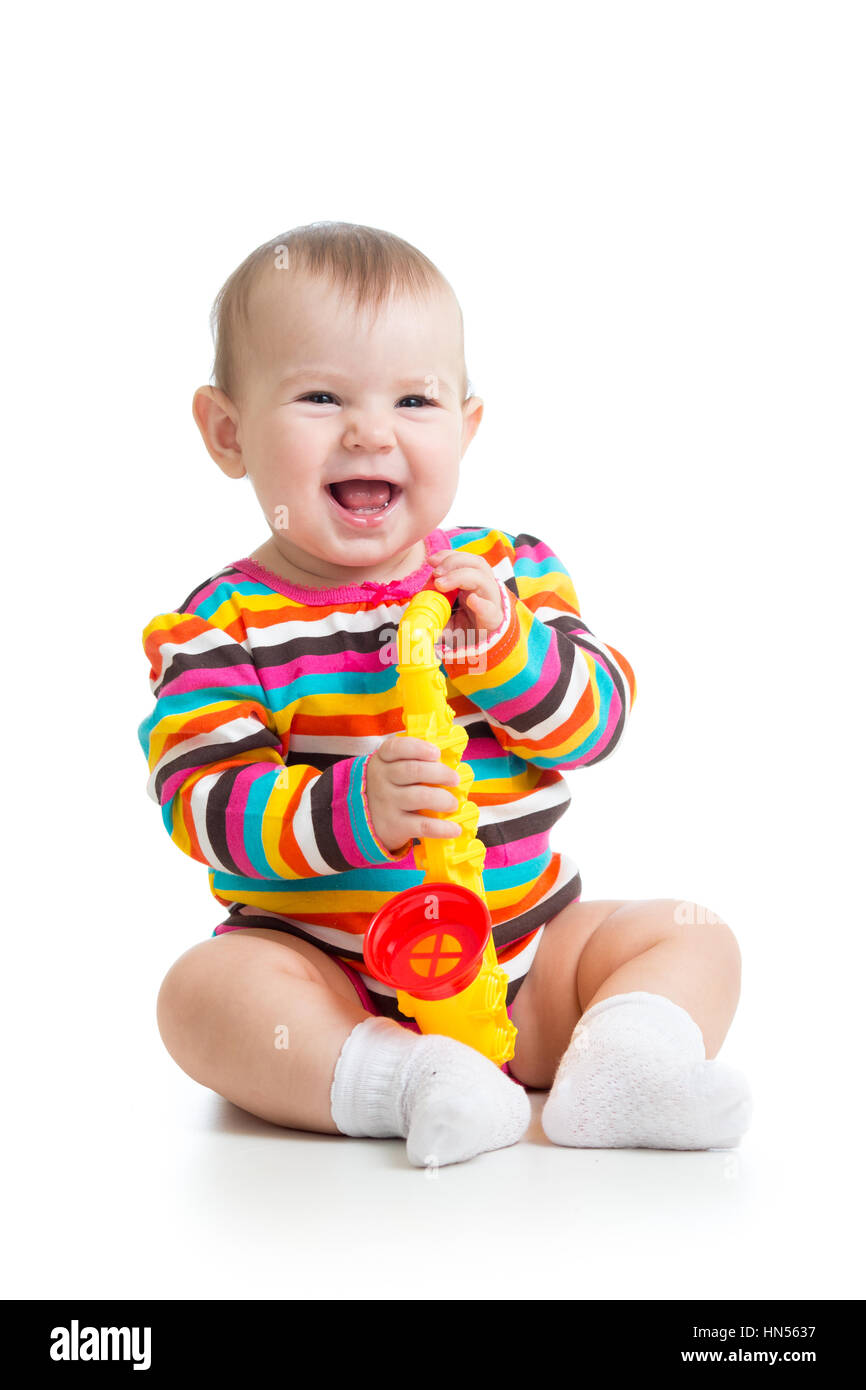 Funny baby girl with musical toy isolated Stock Photo Alamy