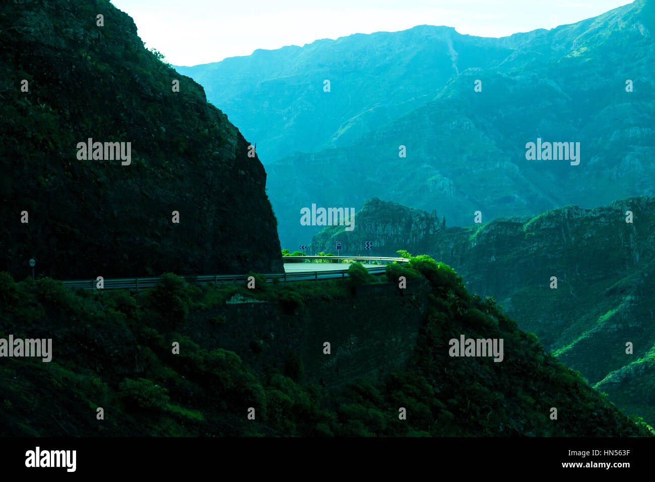 sunlit bend on windy mountain road, garajonay national park, La Gomera, Canary Islands Stock Photo