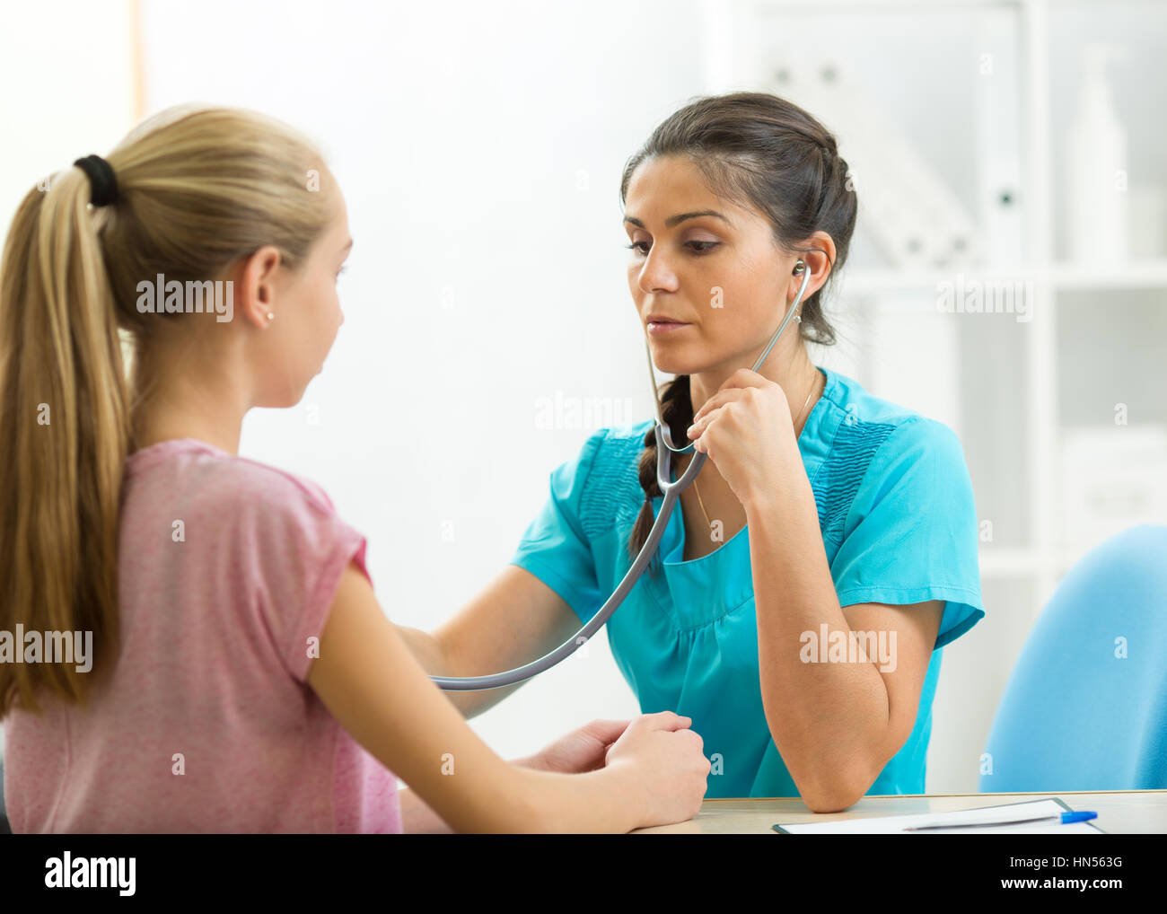 Child Teenager Patient Visiting Doctor's Office Stock Photo