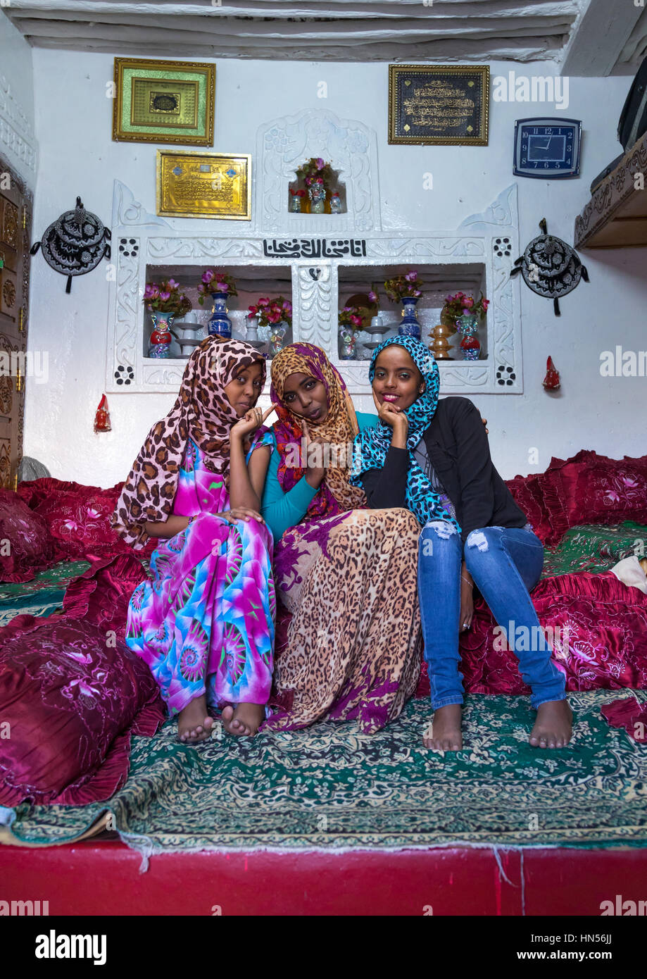 Harari sisters inside their traditional decorated house, Harari Region, Harar, Ethiopia Stock Photo