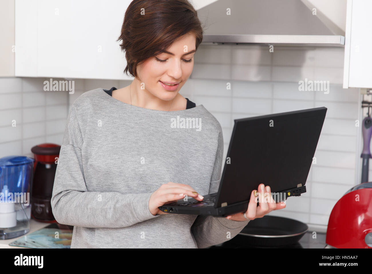 Young girl with black laptop Stock Photo - Alamy
